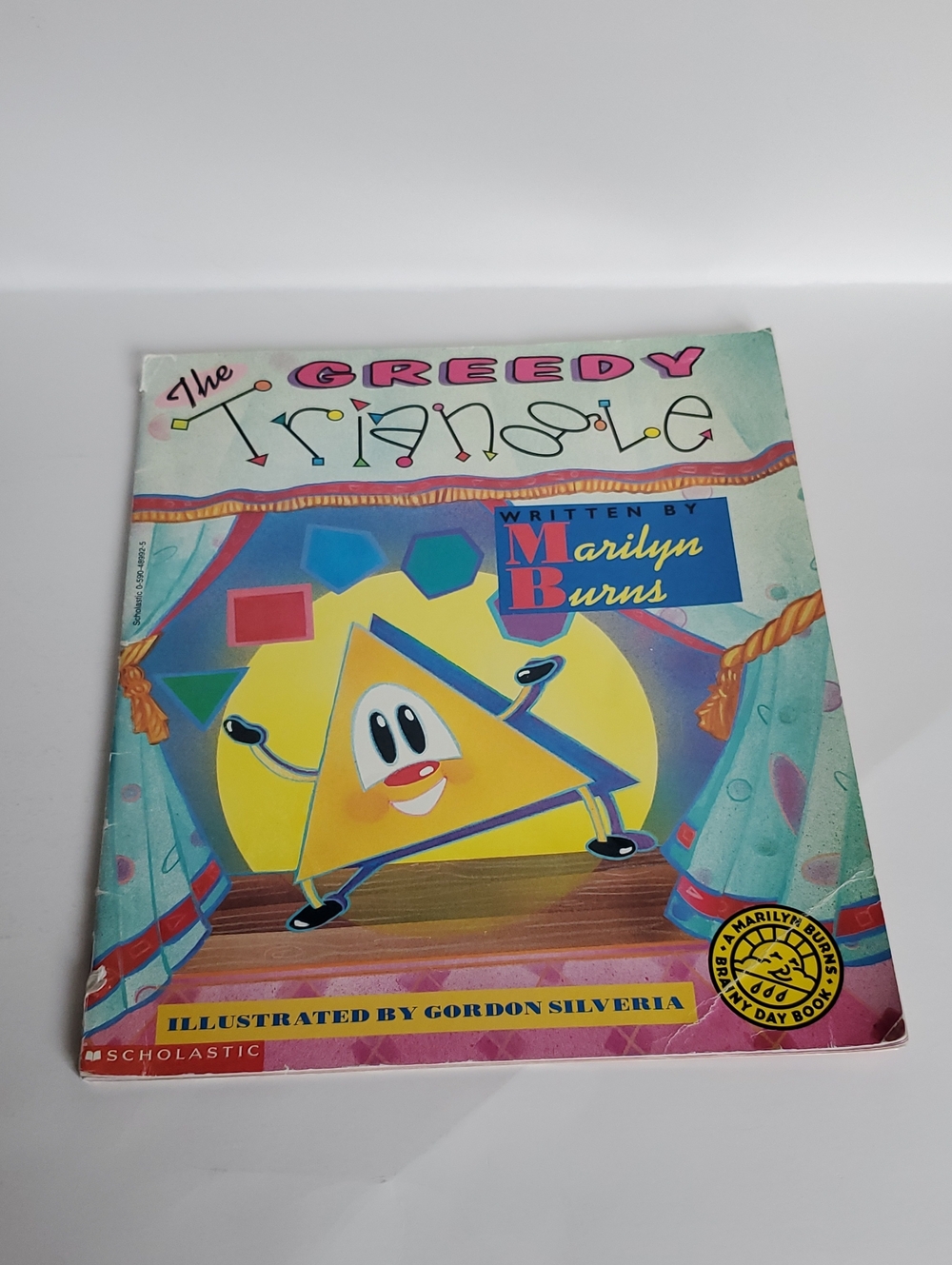 The Greedy Triangle Children's Book -by Marilyn Burns  Preowned Paperback